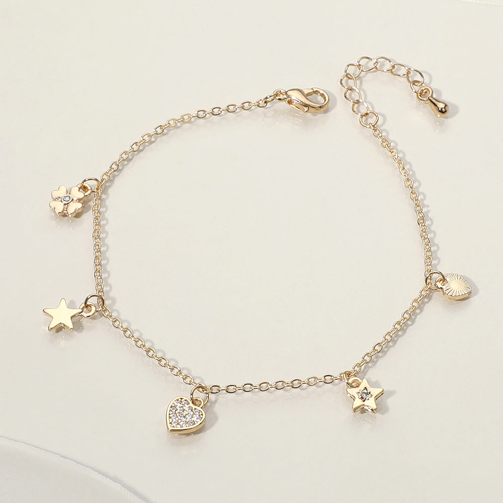 Madeline Love Clear, Gold Stone Paved Heart Star Clover Charm Station Bracelet - Bracelets