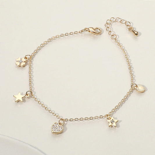 Madeline Love Clear, Gold Stone Paved Heart Star Clover Charm Station Bracelet - Bracelets