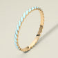 Madeline Love Gold, Light Blue Enamel Inlay Twisted Hinged Bangle Bracelet - Bracelets