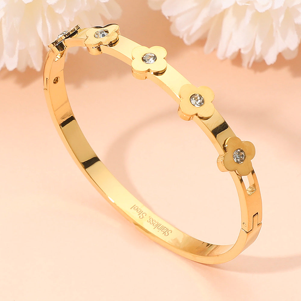 Madeline Love Gold Stainless Steel CZ Stone Accent Quatrefoil Motif Hinged Bangle Bracelet - Bracelets