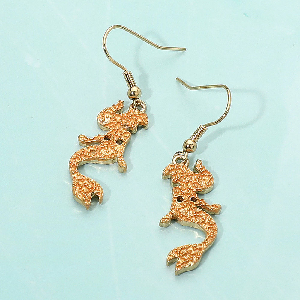 Madeline Love Coral, Gold Colored Metal Mermaid Dangle Earrings
