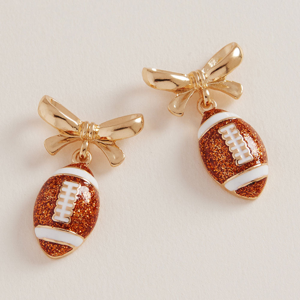 Madeline Love Brown, Gold Bow Accent Football Dangle Earrings