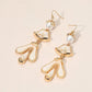 Madeline Love Gold, Ivory Abstract Sculpted Dop Earrings - desc