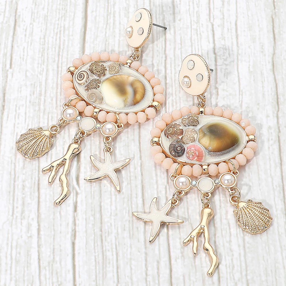 Madeline Love Gold, Neutral Ocean Charm Drop Statement Earrings