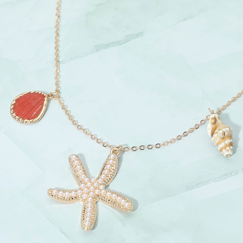 Madeline Love Gold, Red Pearl Pave Starfish Conch Shell Charm Necklace - Necklaces