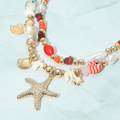 Madeline Love Coral, Gold Coastal Charm Pearl Pebble Beaded Layered Strand Statement Necklace - Necklaces