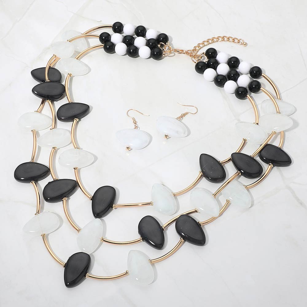 Madeline Love Black, Gold, White Resin Pebble Curved Bar Beaded Layered Statement Necklace - Necklaces - desc