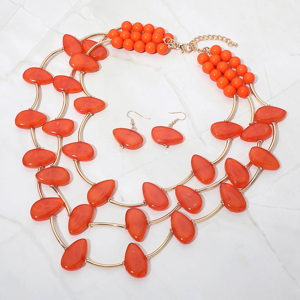 Madeline Love Gold, Orange Resin Pebble Curved Bar Beaded Layered Statement Necklace - Necklaces