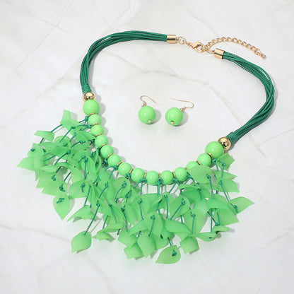 Madeline Love Gold, Green Bold Leaf Fringe Embellished Multi Cord Statement Necklace - Necklaces