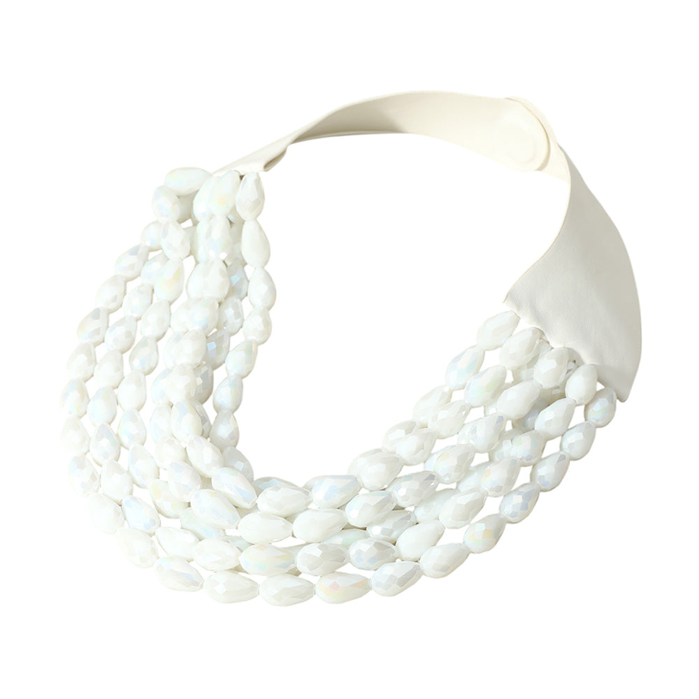 White Elevate your style with this bold multi-strand statement necklace featuring faceted beads and a secure magnetic closure. Perfect for pairing with casual or formal outfits, this elegant accessory adds a modern touch to your look and makes an eye-catching fashion statement.
