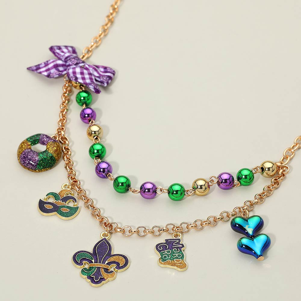 Madeline Love Gold, Purple Bow Accent Mardi Gras Charm Station Layered Statement Necklace - Necklaces
