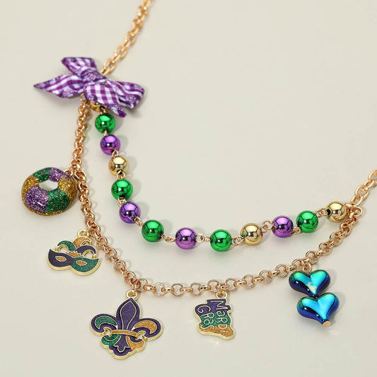 Madeline Love Gold, Purple Bow Accent Mardi Gras Charm Station Layered Statement Necklace - Necklaces