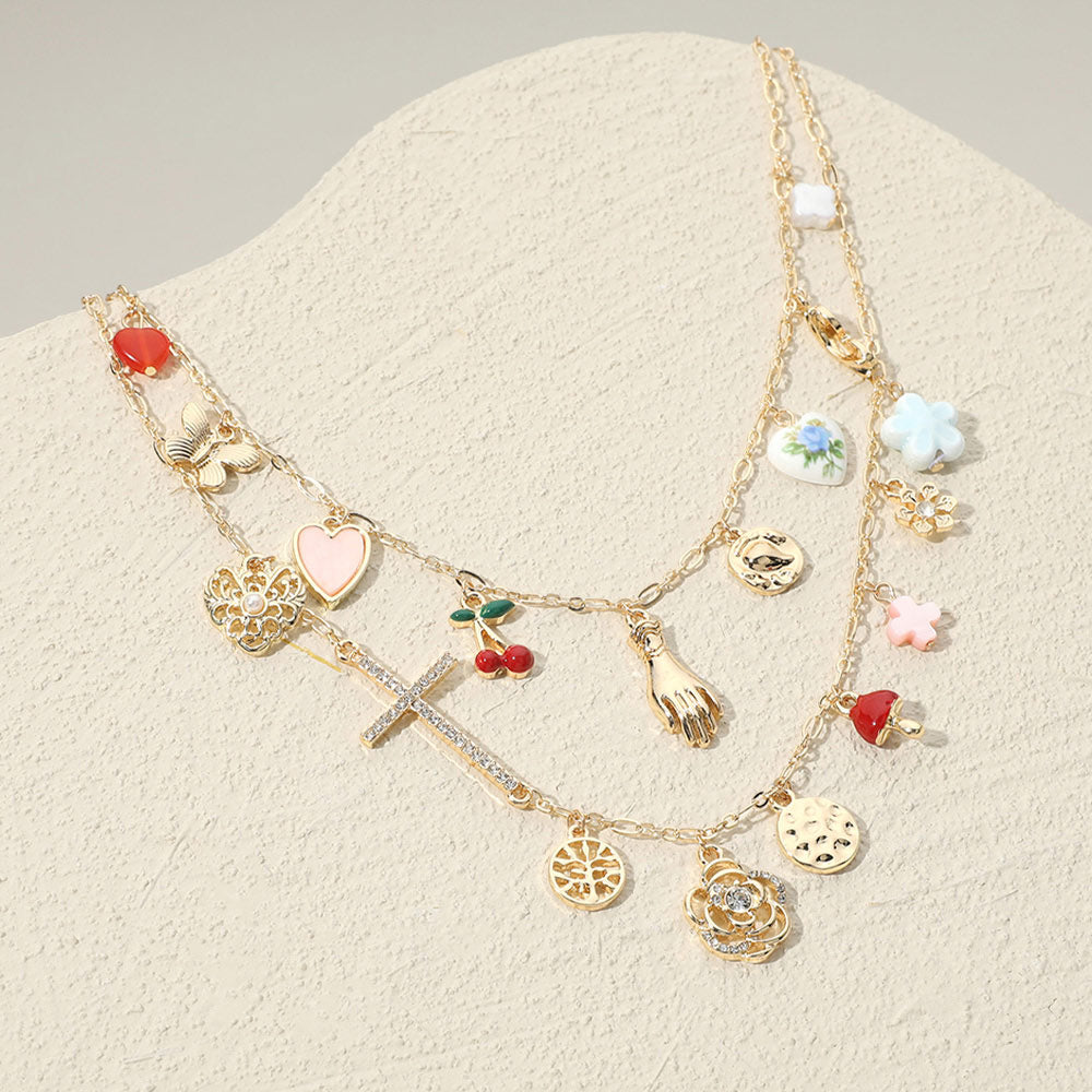 Madeline Love Gold, Multi Stone Paved Cross Enamel Cherry Heart Mushroom Metal Butterfly Ceramic Flower Charm Station Double Layered Necklace - Necklaces