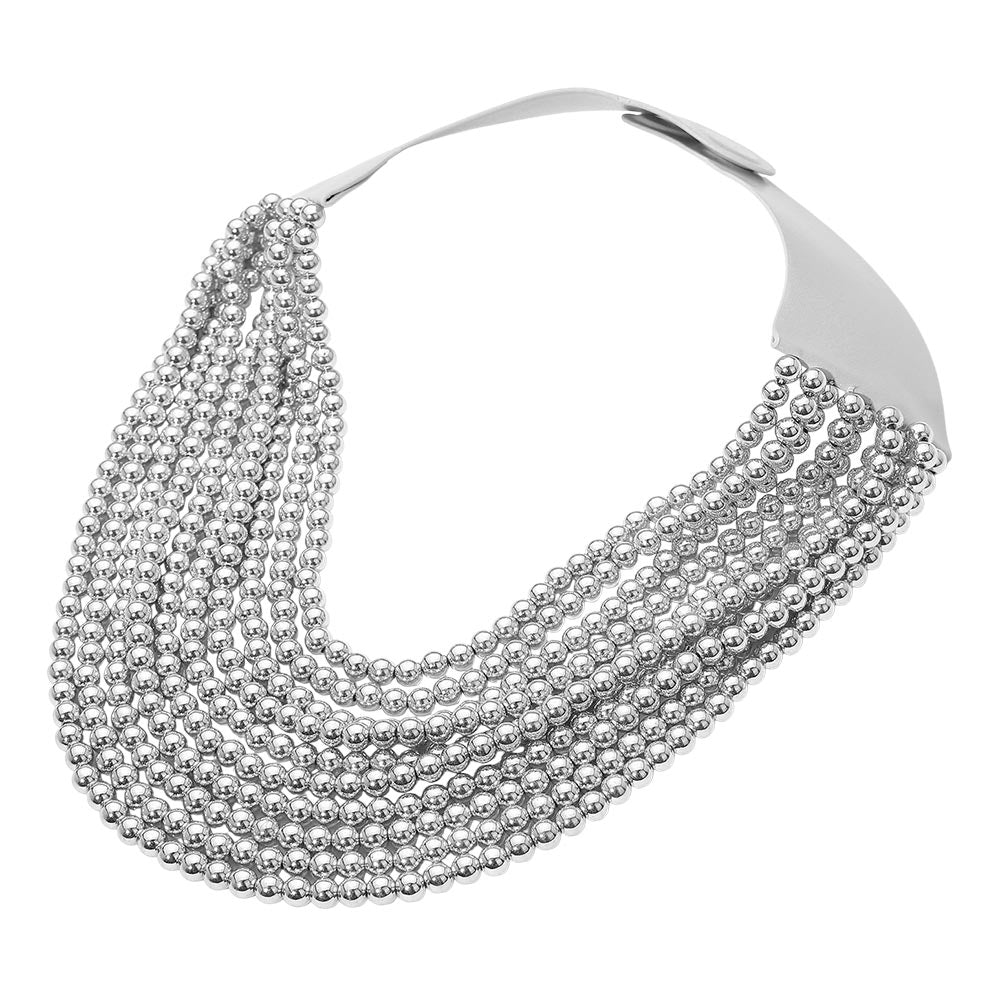 Rhodium Statement collar necklace featuring a flexible curved silhouette and layered beaded design with a secure magnetic closure. Designed to sit comfortably along the neckline, this bold yet refined accessory adds dimension and modern elegance to fashion collections, event styling, and trend-driven looks.