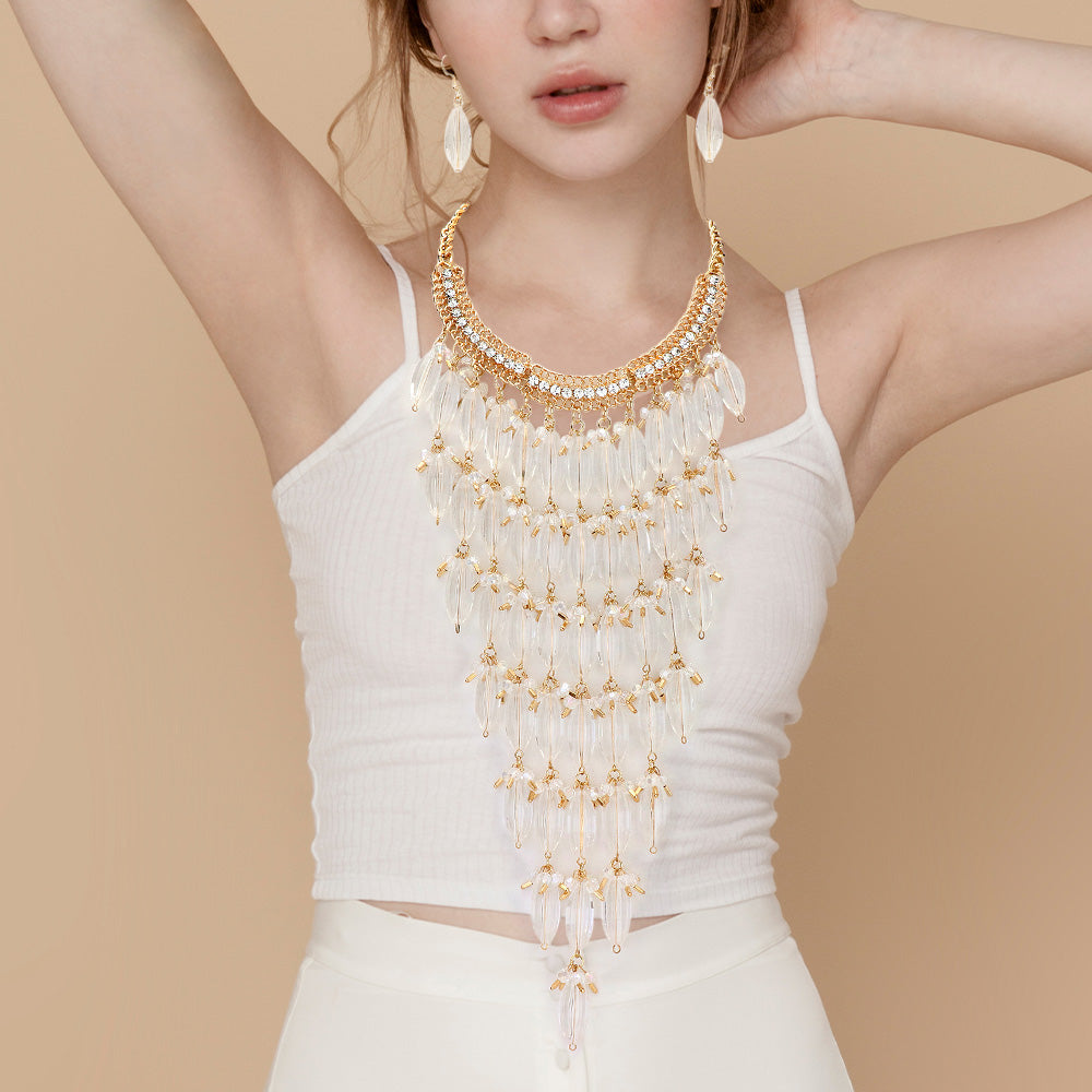 Madeline Love Clear, Gold, Lucite Lucite Stone Embellished Bib Necklace - Necklaces