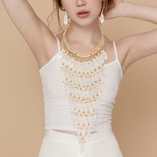 Madeline Love Clear, Gold, Lucite Lucite Stone Embellished Bib Necklace - Necklaces