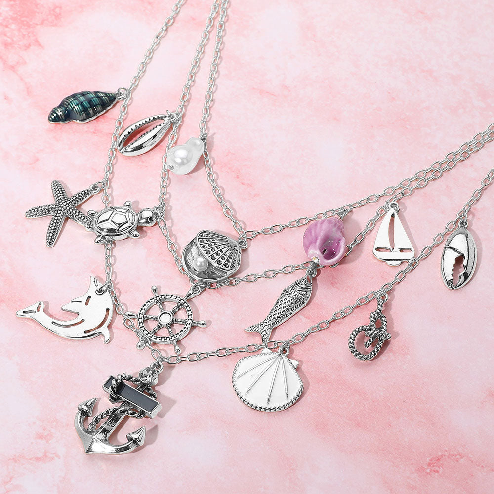 Madeline Love Antique Rhodium, Multi Anchor Sea Shell Pearl Dolphin Fish Rope Sea Turtle Charm Embellished Triple Layered Necklace - Necklaces