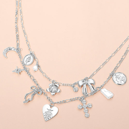 Madeline Love Silver Bow Heart Floral Cross Pearl Crescent Coin Charm Station Layered Necklace - Necklaces