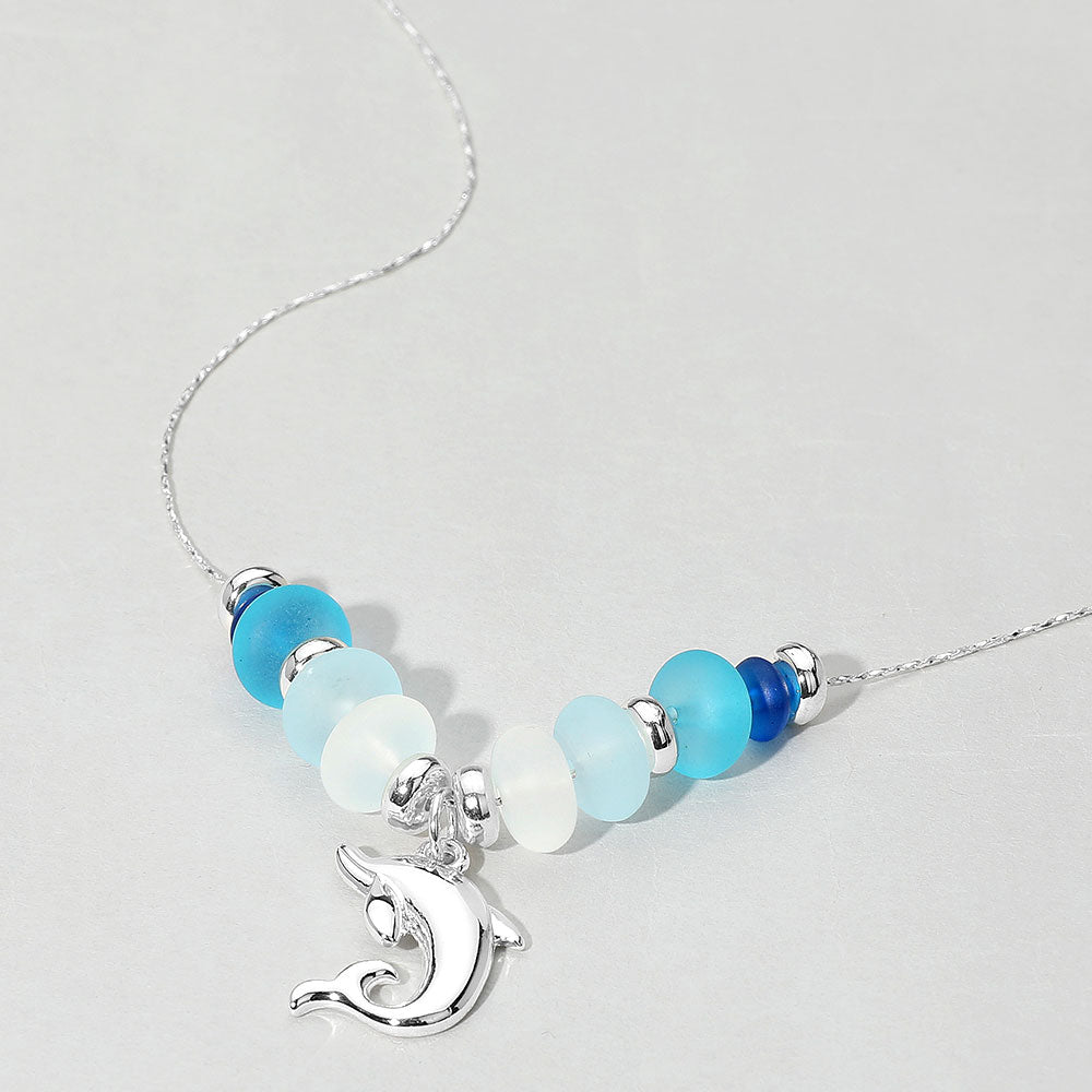 Madeline Love Blue, Silver Dolphin Charm Frosted Beaded Necklace - Necklaces