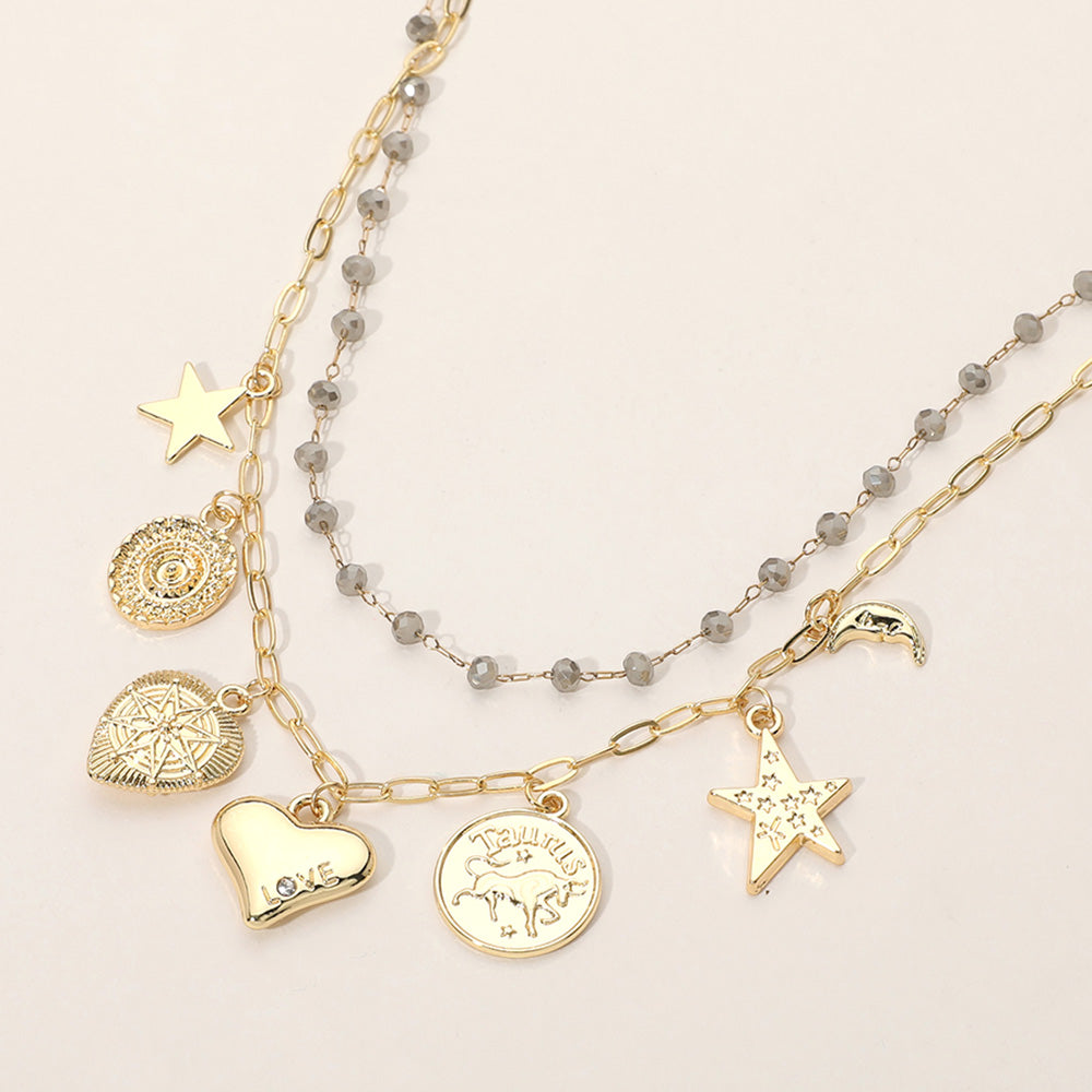 Madeline Love Gold, Gray Metal Zodiac Taurus Medal Star Heart Crescent Charm Station Faceted Beads Station Layered Necklace