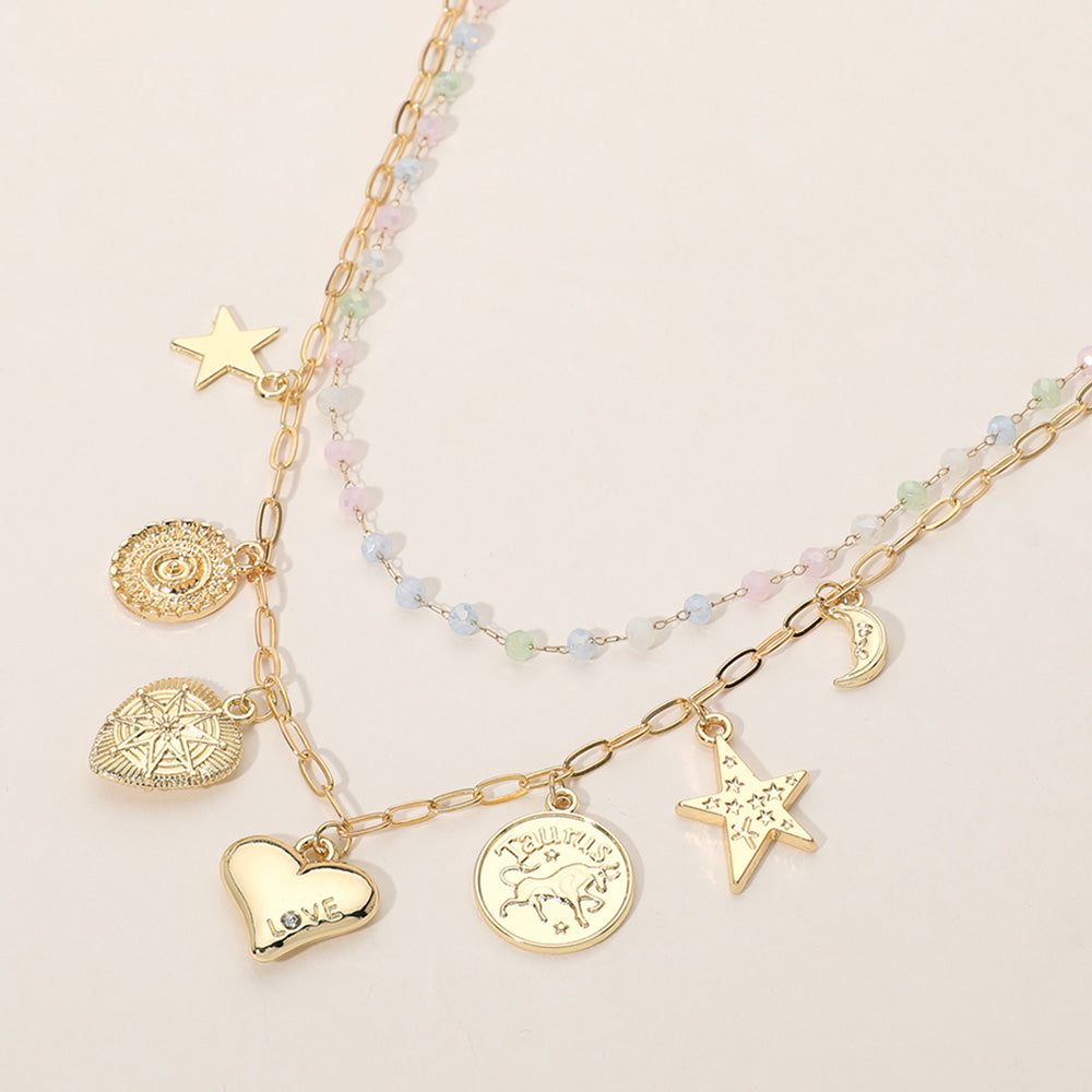 Madeline Love Gold, Multi Metal Zodiac Taurus Medal Star Heart Crescent Charm Station Faceted Beads Station Layered Necklace