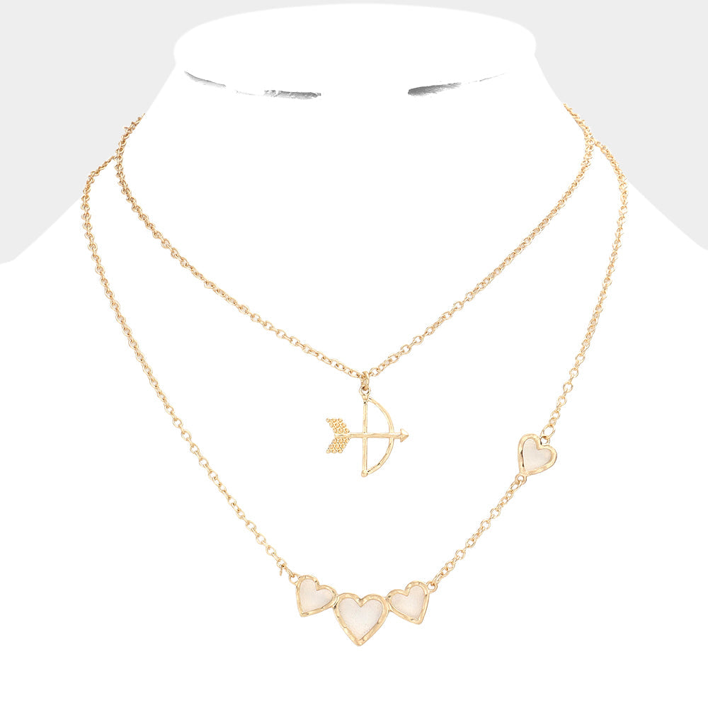 Worn Gold 2-piece set of Cupid's Arrow Heart Pendant Necklaces is the perfect romantic gift. Crafted with delicate detail, the pendants feature intertwined arrows and hearts, symbolising a deep and everlasting love. Made from high-quality materials, these necklaces are both stylish and durable. Give the gift of love with this jewelry set.