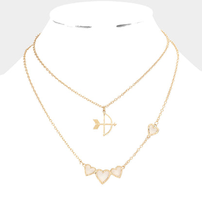 Worn Gold 2-piece set of Cupid's Arrow Heart Pendant Necklaces is the perfect romantic gift. Crafted with delicate detail, the pendants feature intertwined arrows and hearts, symbolising a deep and everlasting love. Made from high-quality materials, these necklaces are both stylish and durable. Give the gift of love with this jewelry set.