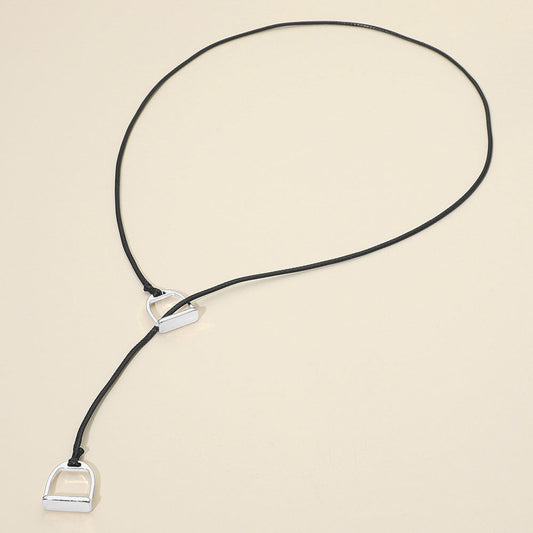 Madeline Love Black, Rhodium Metal Horsebit Lariat Waxed Cord Necklace - Necklaces