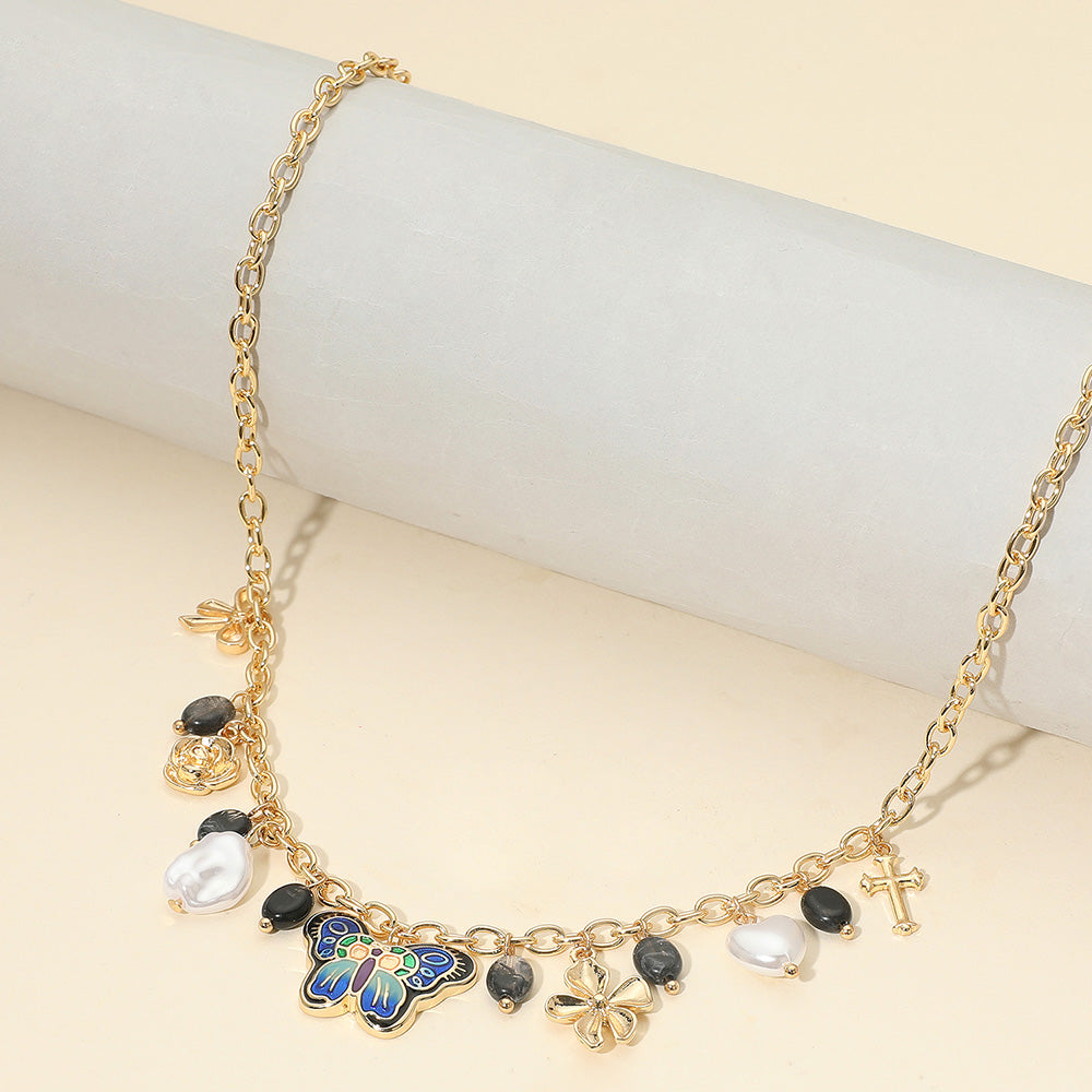 Madeline Love Black, Gold Enamel Butterfly Flower Cross Bow Heart Pearl Charm Station Necklace - Necklaces