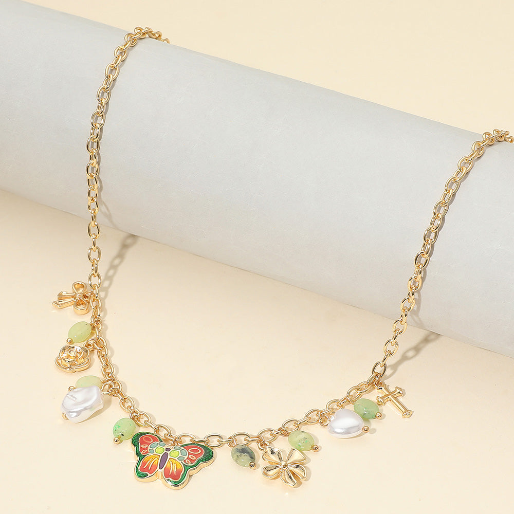 Madeline Love Gold, Green Enamel Butterfly Flower Cross Bow Heart Pearl Charm Station Necklace - Necklaces