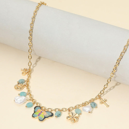 Madeline Love Gold, Navy Enamel Butterfly Flower Cross Bow Heart Pearl Charm Station Necklace - Necklaces