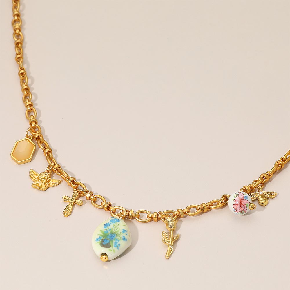 Madeline Love Green, Matte gold Vintage Floral Ceramic Charm Metal Angel Flower Stem Honey Bee Charm Station Necklace - Necklaces