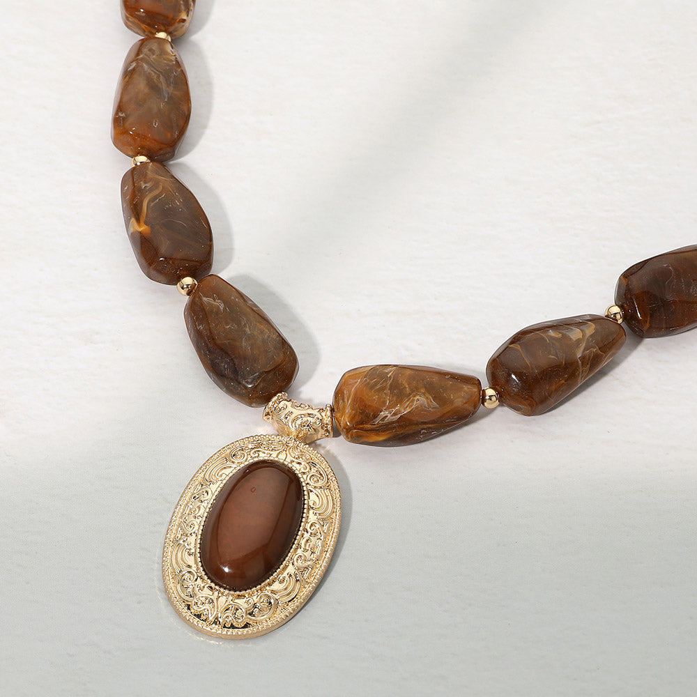 Madeline Love Brown, Worn Gold Ornate Oval Pendant Chunky Beaded Statement Necklace