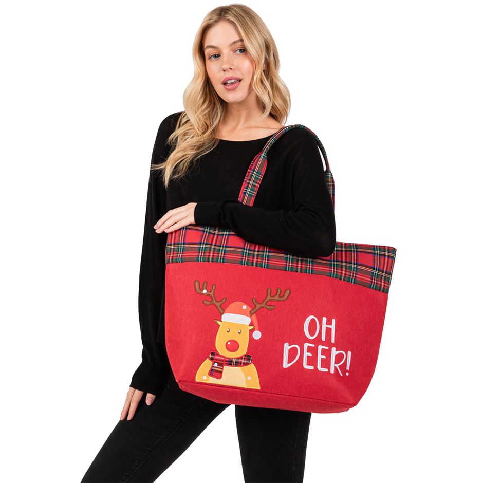 Festive tote bag featuring a playful reindeer and "Oh Deer!" message. Designed with a plaid trim and sturdy handles, perfect for holiday shopping, gifting, or carrying seasonal essentials in style.