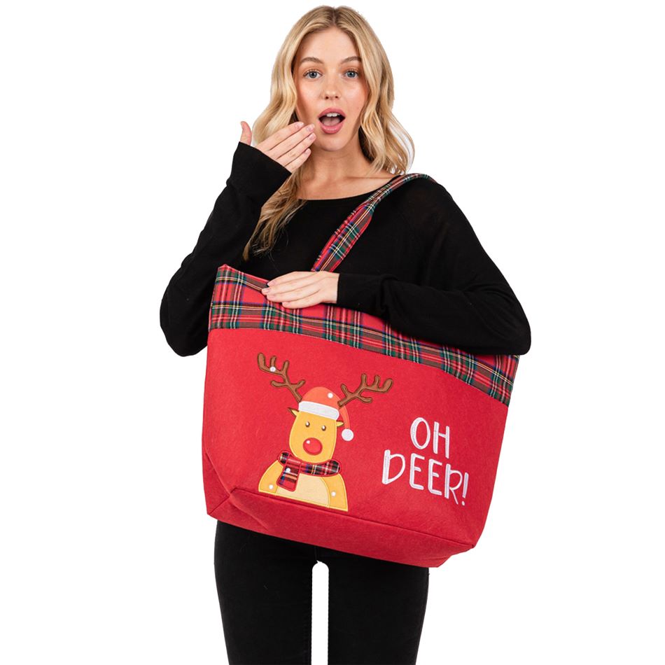 Festive tote bag featuring a playful reindeer and "Oh Deer!" message. Designed with a plaid trim and sturdy handles, perfect for holiday shopping, gifting, or carrying seasonal essentials in style.