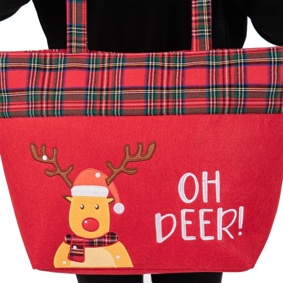 Festive tote bag featuring a playful reindeer and "Oh Deer!" message. Designed with a plaid trim and sturdy handles, perfect for holiday shopping, gifting, or carrying seasonal essentials in style.