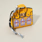 Madeline Love Yellow House Printed Faux Leather Elegant and Stylish Mini Purse Bag Charm - Bags & Wallets