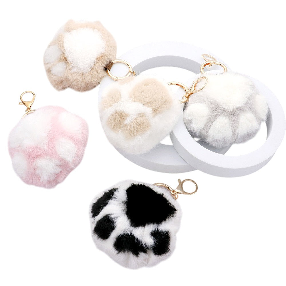 Faux Fur Paw Bag Charm is the perfect accessory for any handbag. Made from high-quality faux fur, this charm adds a touch of luxury and texture to your bag. With a sturdy clasp, it will securely attach to any bag. Bring some personality to your style with this unique charm. 