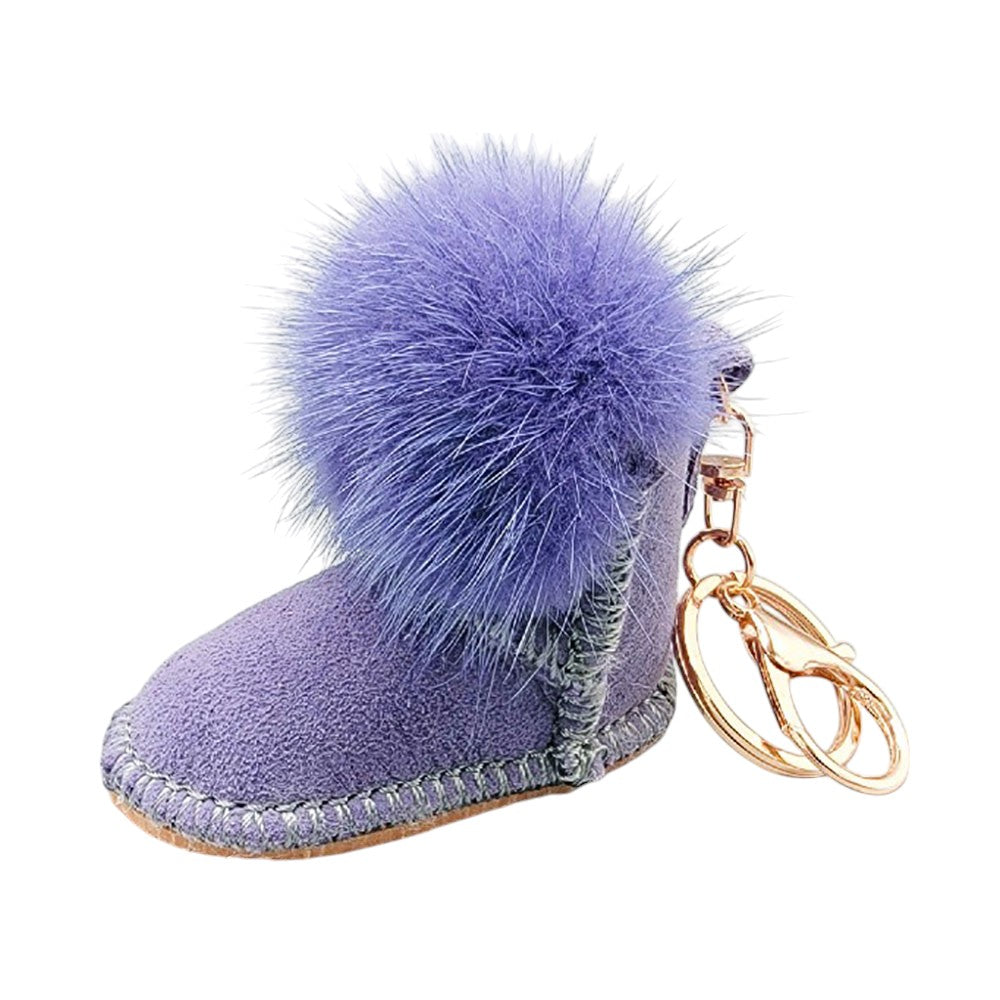 Lavender Faux Fur Pom Pom Boot Bag Charm adds a playful touch to boots, bags, and other accessories. The durable clasp ensures secure attachment, making it a versatile and stylish addition to your everyday look. Perfect for those who love fun and trendy accessories.