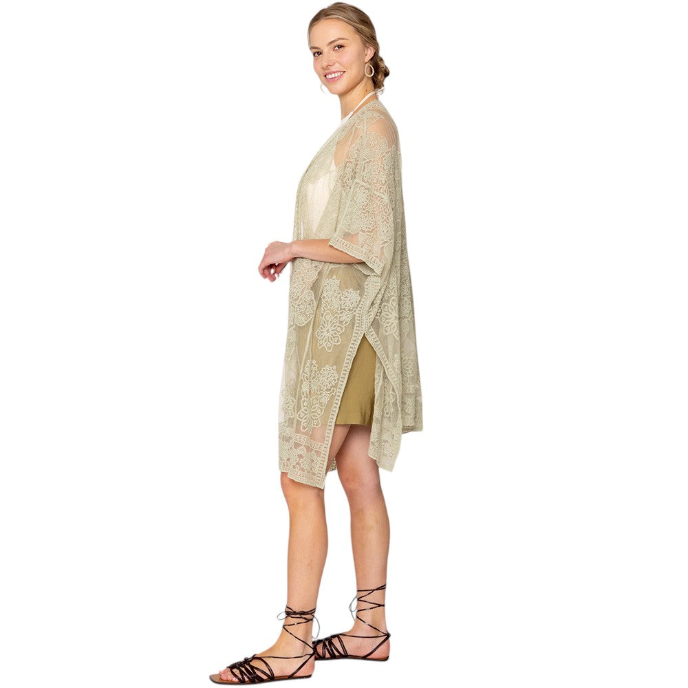 green Flower Lace Kimono Poncho is a versatile and fashionable addition to any wardrobe. The delicate lace detailing adds a touch of elegance, while the kimono style allows for comfortable and easy wear. Perfect for dressing up any outfit, this poncho is a must-have for any fashion-forward individual. 
