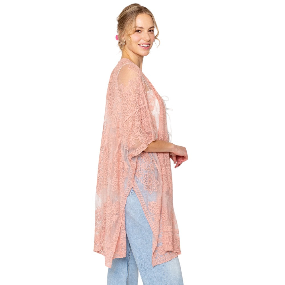 Pink Flower Lace Kimono Poncho is a versatile and fashionable addition to any wardrobe. The delicate lace detailing adds a touch of elegance, while the kimono style allows for comfortable and easy wear. Perfect for dressing up any outfit, this poncho is a must-have for any fashion-forward individual. 