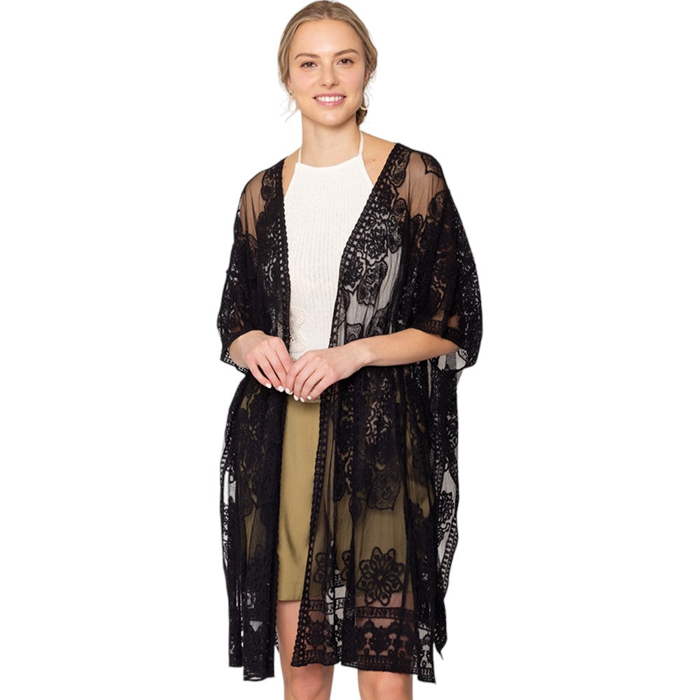 Black Flower Lace Kimono Poncho is a versatile and fashionable addition to any wardrobe. The delicate lace detailing adds a touch of elegance, while the kimono style allows for comfortable and easy wear. Perfect for dressing up any outfit, this poncho is a must-have for any fashion-forward individual. 