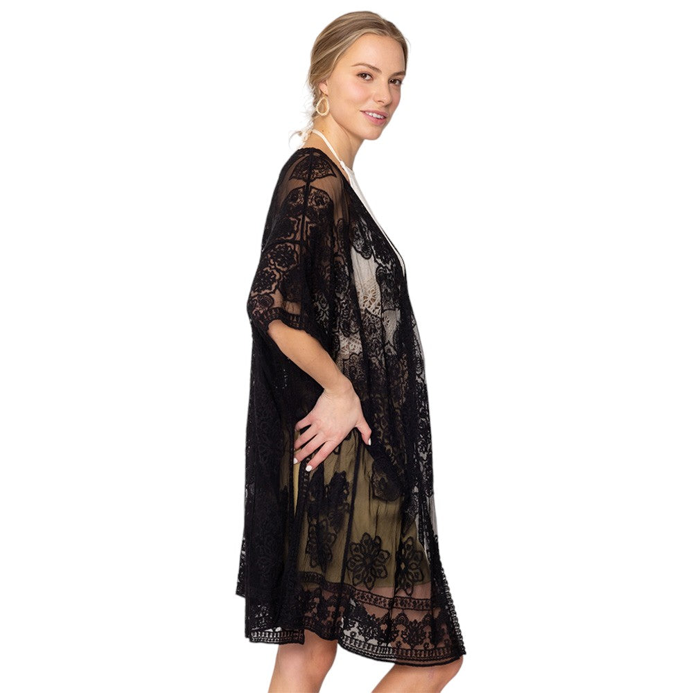 Black Flower Lace Kimono Poncho is a versatile and fashionable addition to any wardrobe. The delicate lace detailing adds a touch of elegance, while the kimono style allows for comfortable and easy wear. Perfect for dressing up any outfit, this poncho is a must-have for any fashion-forward individual. 
