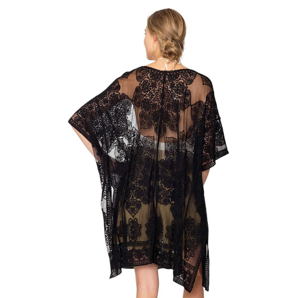Black Flower Lace Kimono Poncho is a versatile and fashionable addition to any wardrobe. The delicate lace detailing adds a touch of elegance, while the kimono style allows for comfortable and easy wear. Perfect for dressing up any outfit, this poncho is a must-have for any fashion-forward individual. 