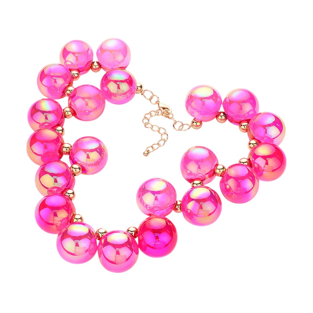 Fuchsia chunky iridescent ball beaded necklace elevates any outfit with its unique and eye-catching design. The perfectly placed beads create a glamorous and statement-making accessory. Crafted with quality materials, this necklace is a must-have for any fashion enthusiast. 