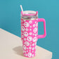 Fuchsia Happy Face Printed 40oz Stainless Steel Tumbler With Handle is perfect for keeping your drinks hot or cold for hours. Made of durable stainless steel and featuring a fun happy face print, this tumbler is a great addition to your drinkware collection. With its large 40oz capacity and convenient handle, you can enjoy your favorite beverages on the go while spreading joy and happiness.