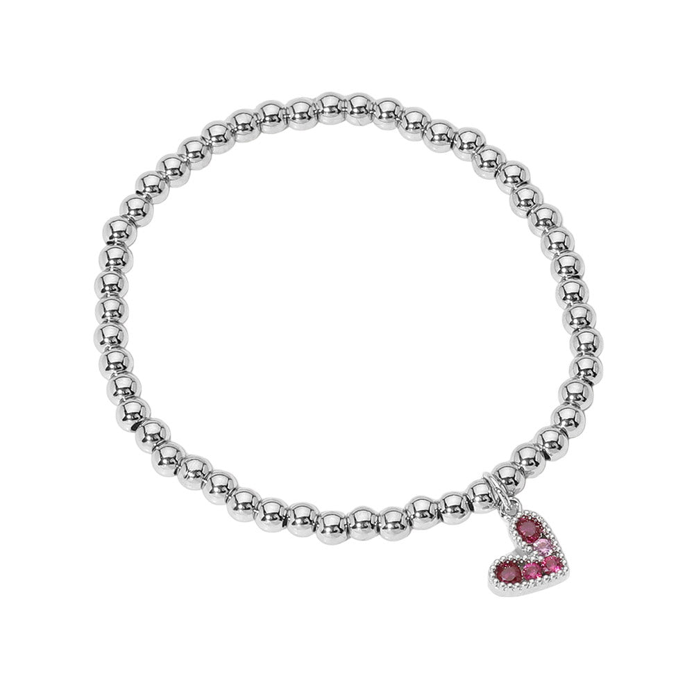 Fuchsia Silver Stainless Steel Ball Heart Charm Beaded Stretch Bracelet combines durability with style to add a touch of elegance to any outfit. Featuring a fuchsia silver color and a heart-themed design, this bracelet stretches for a comfortable fit. Made with lead and nickel compliant stainless steel, it is a safe and versatile addition to your jewelry collection.