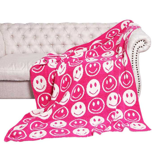 Fuchsia Smile Patterned Reversible Throw Blanket, this ultra-soft throw provides warmth and comfort to any living space. It's made from high-quality materials and features a reversible design featuring a fun, cheerful smile pattern that adds a touch of personality to your home. Perfect winter gift for family and friends.