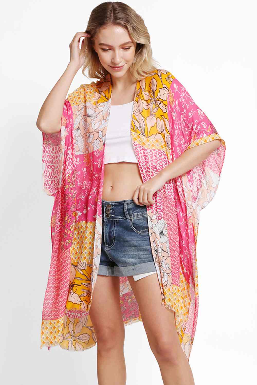 Fuchsia Effortless summer style meets comfort in this floral mixed pattern kimono cover up. Crafted from 100% viscose, the lightweight fabric drapes beautifully while keeping you cool and comfortable. The versatile one-size fit works for various body types, making it perfect for beach days, poolside lounging, or casual outings. Layer it over your favorite swimsuit or dress for an instantly polished look. Ideal for warm weather adventures.