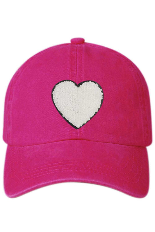 Fuchsia The Heart Applique Baseball Cap adds a charming touch to everyday outfits with its stylish embroidered heart detail. Designed for comfort and casual wear, it features a classic fit that’s perfect for daily use and effortless styling.